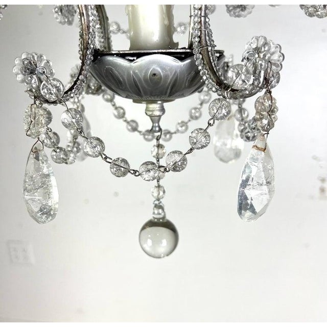 French (4) light rock crystal beaded chandelier with garlands. This chandelier is a classic design with four arms , each...