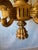 Large Neoclassical gilt wood six light chandelier. The leaf knopped standard issuing drum into six S scrolled arms.