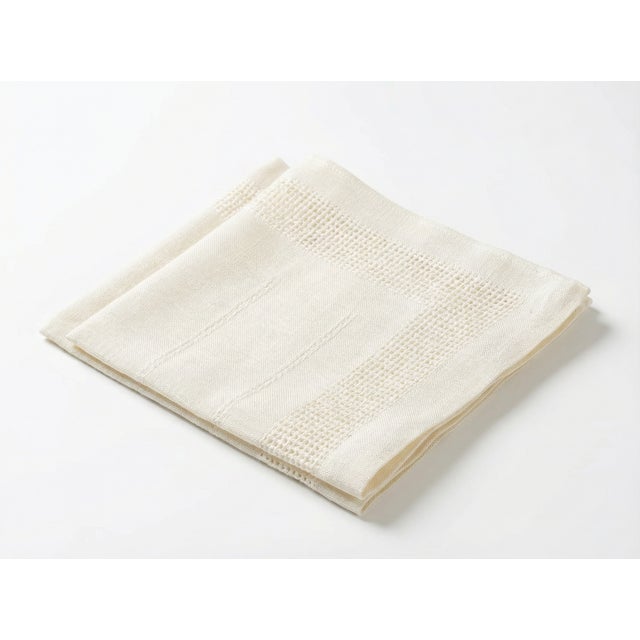 Elegant and timeless, this pair of antique linen napkins features delicate hand-embroidered details and a soft natural...