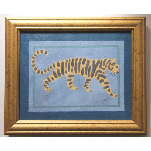 A tiger silhouette in muted shades of slate blue, goldenrod, gray with a a navy and aqua green border. Abstract,...