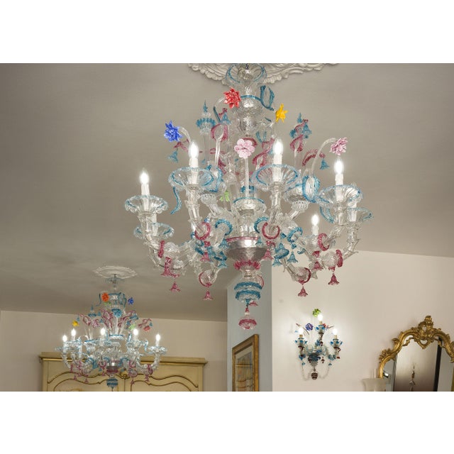 An elegant pair of Ca' Rezzonico chandeliers in blown Murano glass, a true expression of the 18th-century Venetian Baroque...