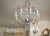 An elegant pair of Ca' Rezzonico chandeliers in blown Murano glass, a true expression of the 18th-century Venetian Baroque...