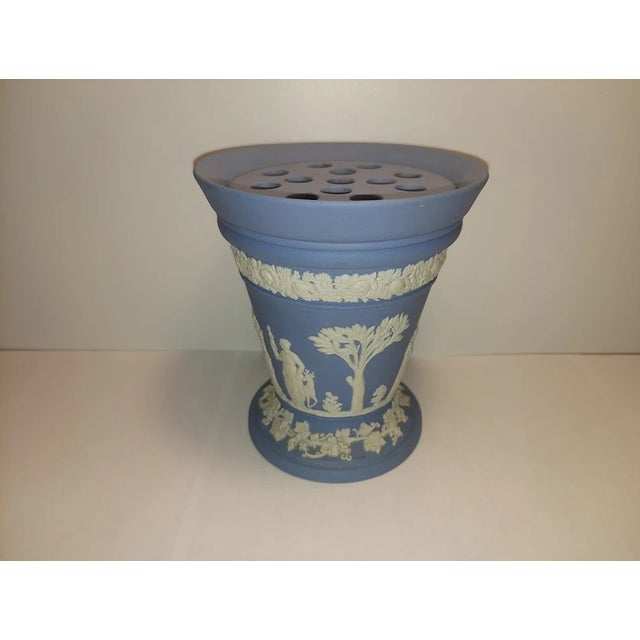 Beautiful vintage Wedgwood blue Jasperware vase featuring classic white neoclassical relief detailing. This elegant 5-inch...
