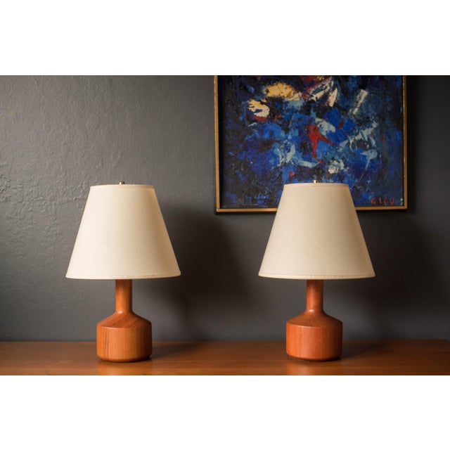 Vintage Pair of Scandinavian Modern lamps circa 1960s. This unique set features a sculptural solid turned base in old...