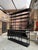 This very large display shelf, from the 1980s, is made of patinated wood and has been fully restored. It consists of a...