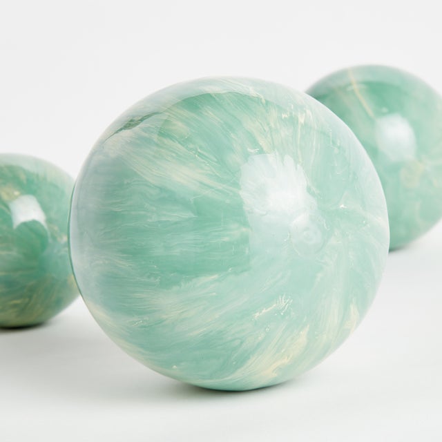 In a clever use of enameled iron, this lightweight orb is painted by hand. A refined, luminous design, each one prettier...