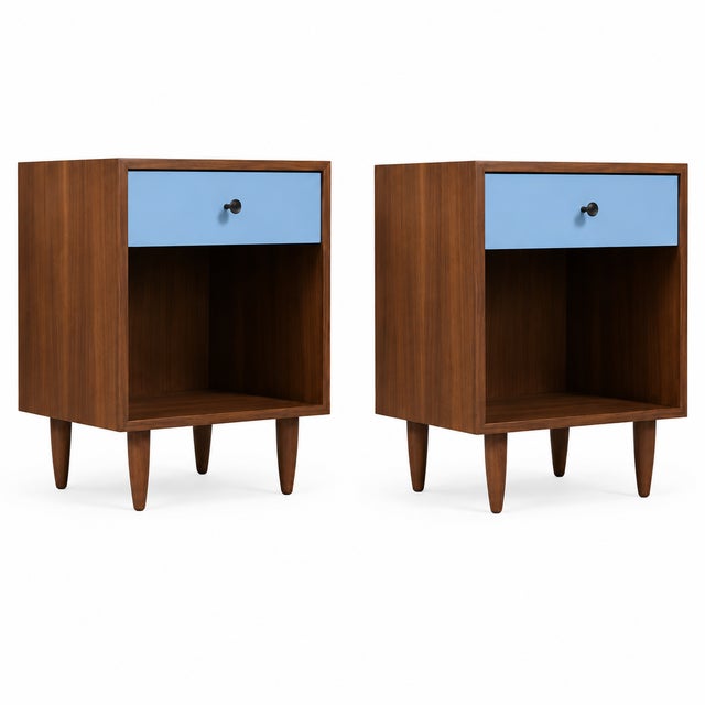 Mid century modern 2 tone walnut stands. Stands are in excellent condition. The stands are in manner of Glenn of...