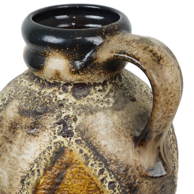 Bold vintage "fat lava" vase featuring a flame-like pattern and thick drip glaze; made by dumler & breiden—a high-quality...