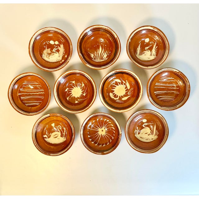 Vintage Home is pleased to present this set of 10 Vintage Mexican Folk Art hand-crafted terra cotta pottery bowls. They...