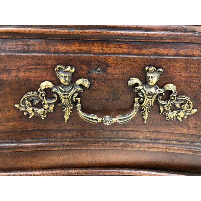 18th. C. French Louis XV chest consisting of three oversized carved drawers with bronze hardware and escutcheons depicting...