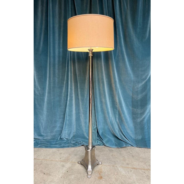 A handsome French Neoclassical floor lamp dating from the 1940s, distinguished by its elegant proportions and refined...