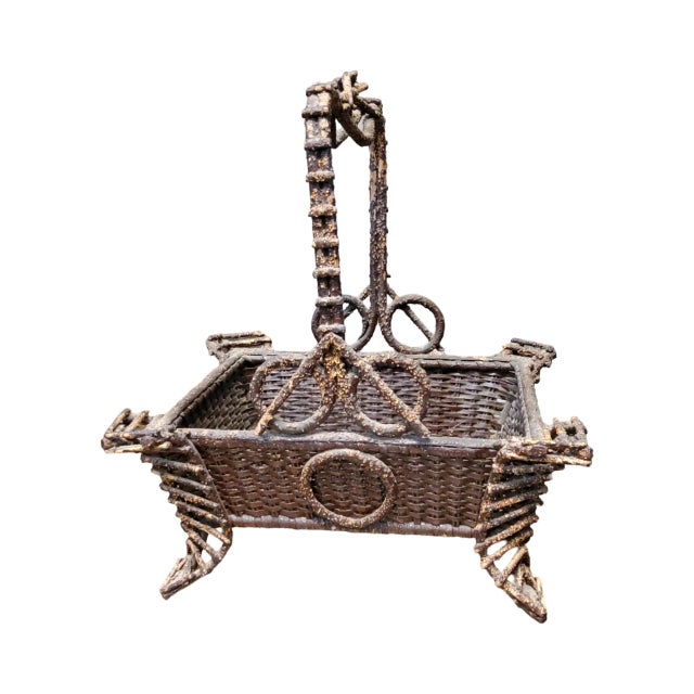 A 19th C American Folk Art Twig Basket measures 12.25 inches wide by 10 inches deep and 14 inches high.