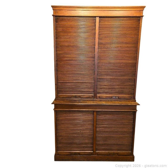 Tall oak tambour-door cabinet / filing or storage cabinet Material: Solid oak (quarter sawn oak likely), tambour (slatted...