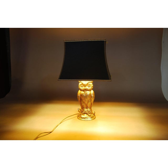 Vintage gold-toned metal owl table lamp, attributed to Loevsky & Loevsky and recorded as made by Deknudt, Belgium. The owl...