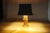 Vintage gold-toned metal owl table lamp, attributed to Loevsky & Loevsky and recorded as made by Deknudt, Belgium. The owl...