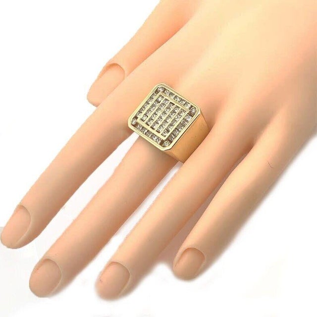 This large, hefty men's ring is crafted from 14k yellow gold with a polished finish featuring a double square top and wide...