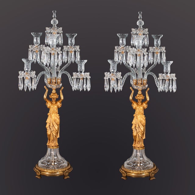 An imposing and finely made pair of mid‑19th‑century French girandoles in the Louis XVI Revival taste, each modeled as a...