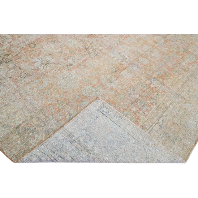 Beautiful Antique Shabby Chic Mahal hand-knotted wool rug with a rust-orange color field. This Persian rug has blue and...