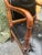 A striking mid-century Hollywood Regency-style revival armchair exhibiting exceptional bench-made craftsmanship. The dense...