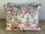 Pair of custom pillows made with a printed chinoiserie cotton front and a coordinating green back and self welt detail....