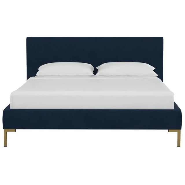 This low profile fully upholstered platform bed is a perfect piece for anyone looking to add a modern statement piece to...