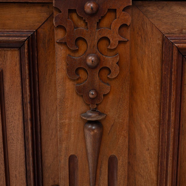 A grand 19th Century English Renaissance Revival buffet showcasing the ornate craftsmanship of its era. This piece is...