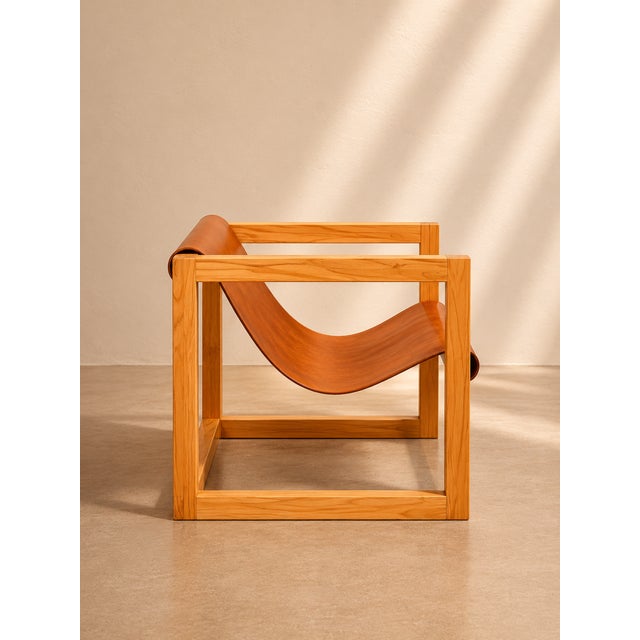 Handcrafted suspended leather lounge chair made from solid wood and thick full-grain leather. Designed with a clean...
