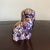 A pair of antique purple lusterware Staffordshire spaniels.