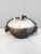 This irregularly shaped lidded box is a distinctive example of handmade Raku ceramics from the 1980s. The rough, vibrantly...