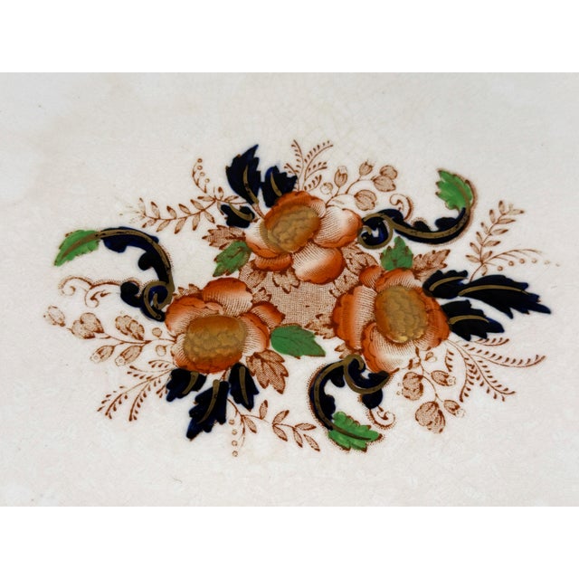 This antique English ceramic platter was made by John Haddock & Sons in the 'Majestic' pattern. The oval platter features...