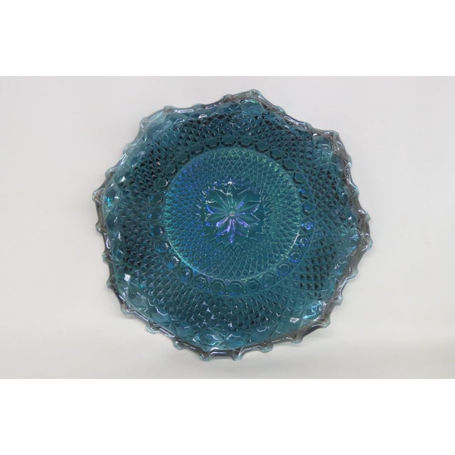 This magnificent Iridescent / Centerpiece Dish is made of carnival glass. This piece has brilliant vintage style; it...