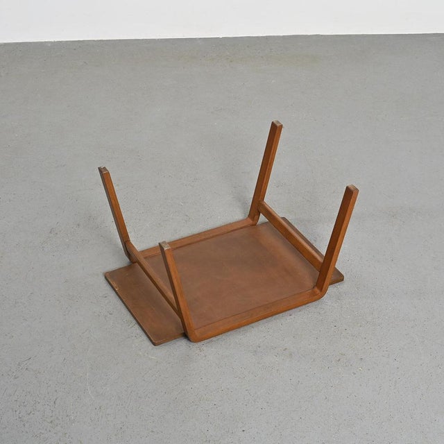 Side table designed by Isamu Kenmochi, an emblematic figure of Japanese design, with a constant concern for functionality...