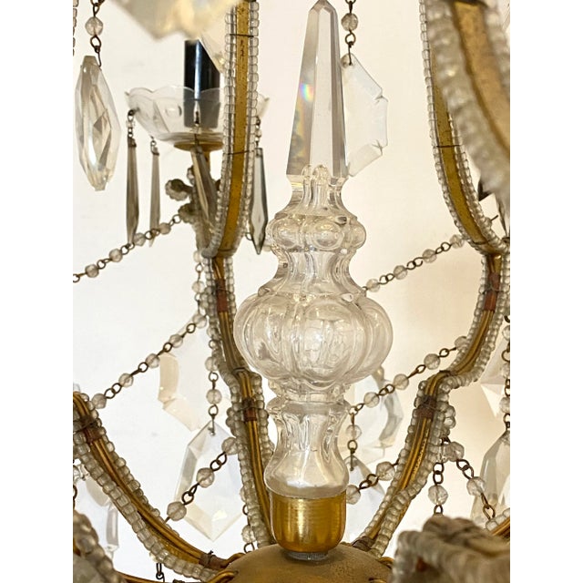 60s chandelier, golden iron structure and glass pendants European Plug (up to 250V).The wiring of this item may be...