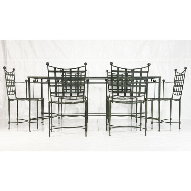 An elegant and increasingly rare seven-piece wrought iron patio dining set designed by Mario Papperzini for Salterini,...