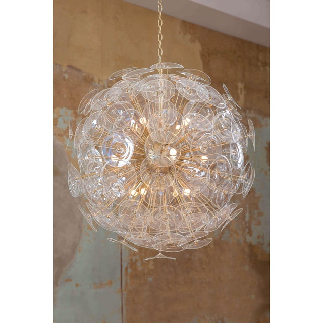 Create a glamorous modern statement in your dining room or master bath with Poppy, a stunning sputnik-style orb...
