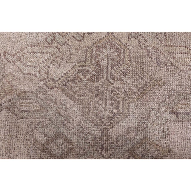 This exquisite antique Turkish Oushak rug from the 1930s measures approximately 161? x 161?. It showcases the...