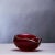 The deep red cased and iridized glass, bowl and stubber (cendrier / ashtray) was designed by carlo scarpa (1906-1978)...