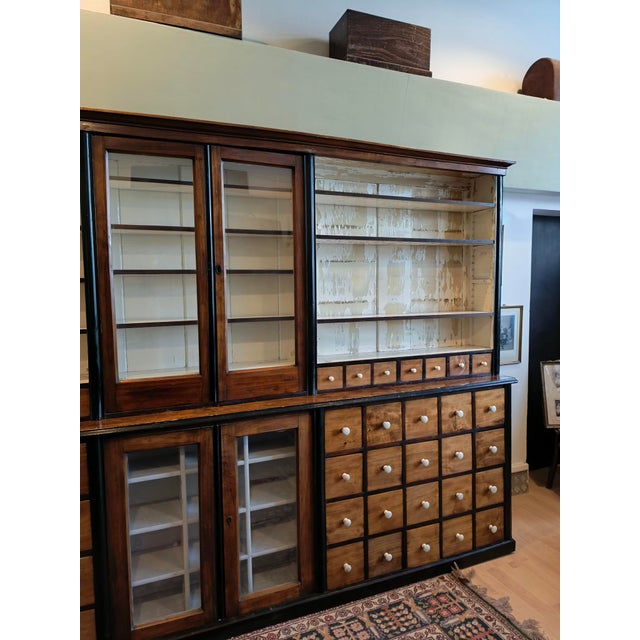 This pharmacy cabinet, made around 1900-1910, was once in a rural pharmacy. It was probably larger, in its current state...