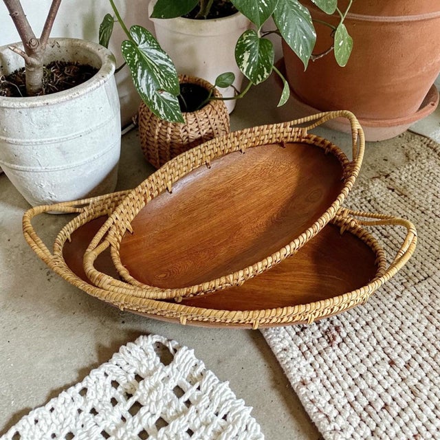 Elevate your dining experience with the Vintage 1970s Oblong Wood Mango Bowl, featuring a charming rattan trim that adds a...