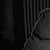 The artwork portrays a figure reclining on a plush couch, enveloped in shadows that create a moody and intimate...