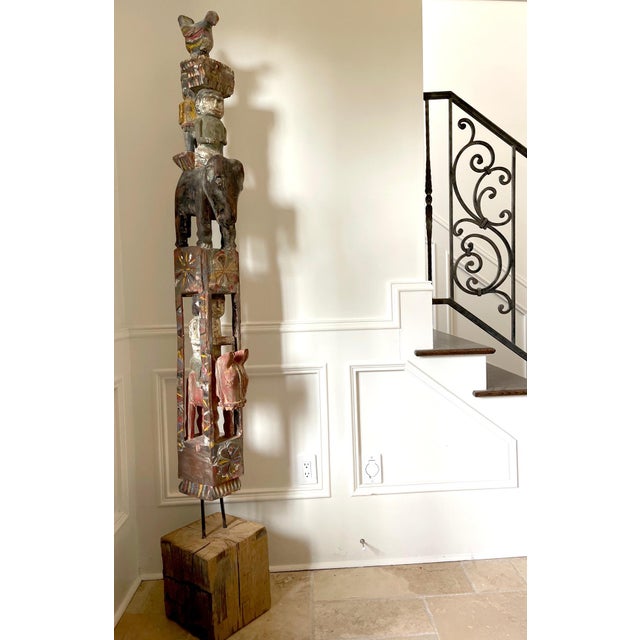 A striking architectural pole carved from solid teak that was used for building construction in Burma circa 19th century....