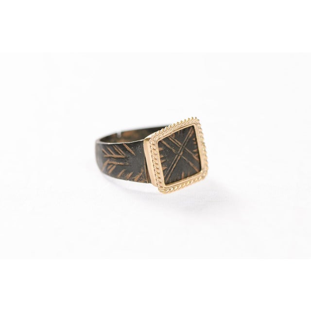 A Byzantine Bronze Ring w/ 21 Karat Gold Rope Square Trim and hand chiseled decorative accents from Byzantine era. The...