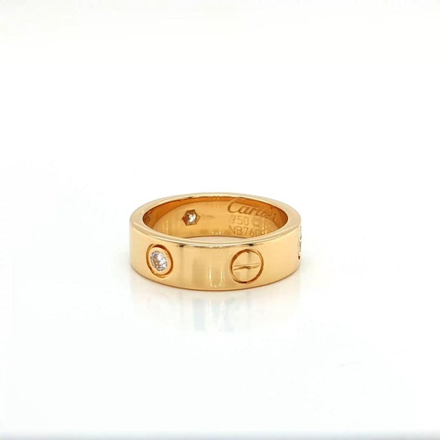 This elegant authentic classic ring by Cartier from the LOVE collection is crafted in solid 18k yellow gold with a...