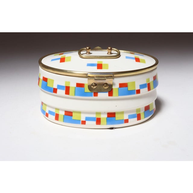 Art Deco ceramic and brass biscuit tin with attractive geometric motif in lime green, blue, and red (ca. mid 1920s-early...