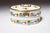 Art Deco ceramic and brass biscuit tin with attractive geometric motif in lime green, blue, and red (ca. mid 1920s-early...