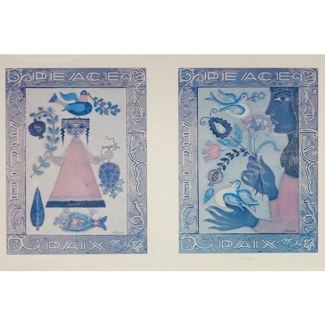 This enchanting double-panel artwork radiates a serene, folkloric charm rooted in the traditions of folk art with touches...