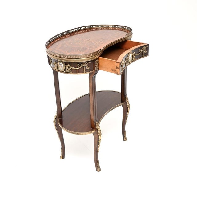 A gorgeous antique French style inlaid kidney side table, dating from around the 1950’s period. This has a beautiful and...