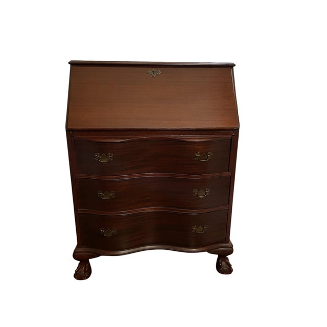 Early 20th century Colonial Revival slant-front secretary desk, dating to approximately 1910. This elegant piece features...