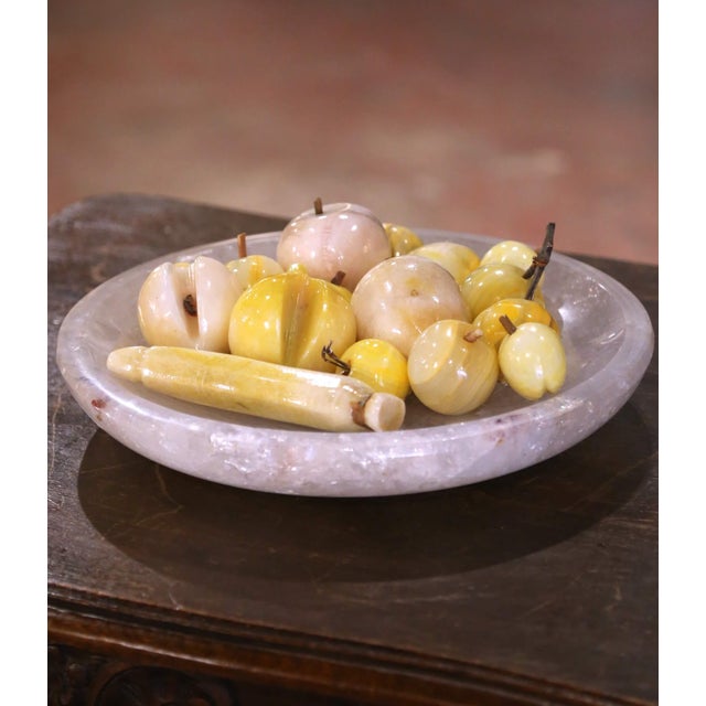 Add a touch of timeless charm to your home with this set of sixteen carved stone fruits, perfect for styling an entryway...