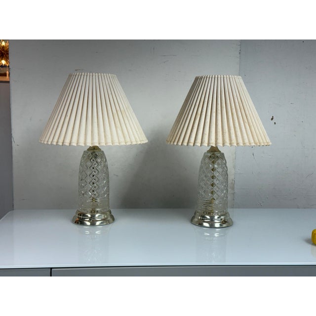 Design Plus Gallery presents a Pair of Cut Glass Table Lamps from Crystal-Clear Industries. Each lamp combines a clear-cut...